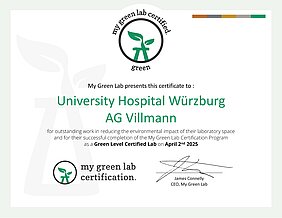 MyGreenLab-Zertikat für die AG Villmann. Das Logo der MyGreenLab-Initiative ist eine Pflanze in einem Reagenzglas.